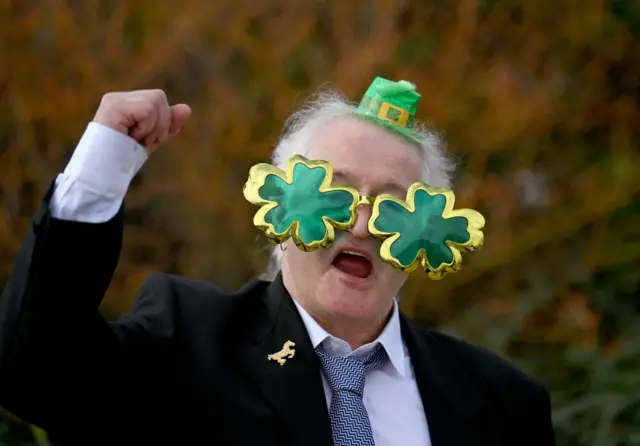 Man wearing Irish clover glasses