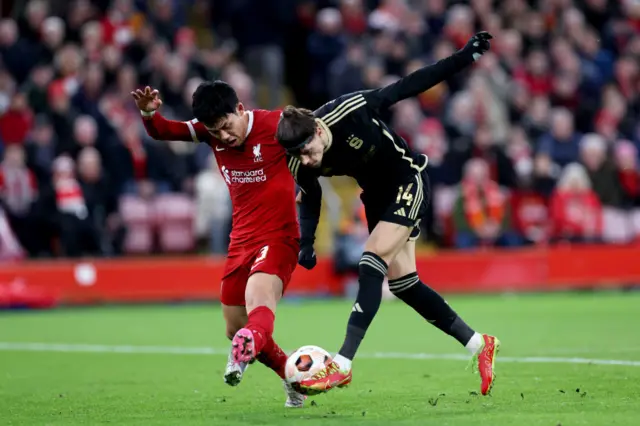 Endo and Birmancevic duel for the ball in the middle.