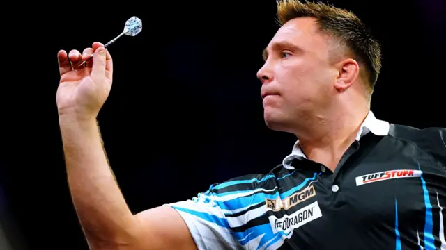 Gerwyn Price throws a dart