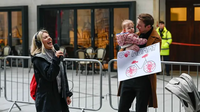 Molly cheered on by baby Annabella and fiancé Stuart