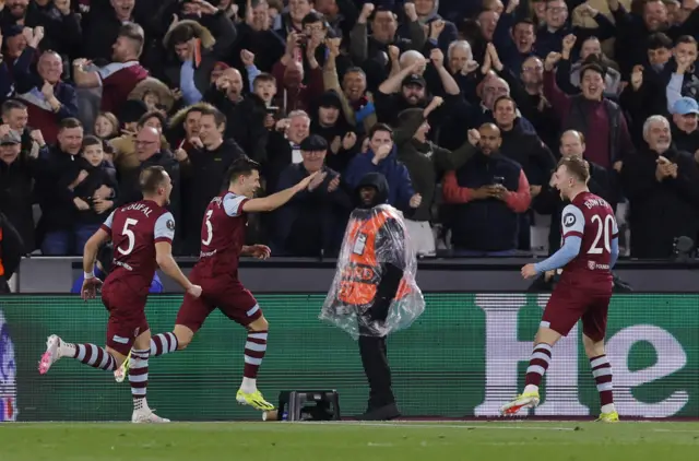 West Ham players celebrater Cresswell's goal in front of the home fans