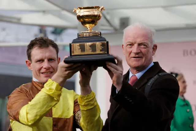 Paul Townend and Willie Mullins lift the Gold Cup