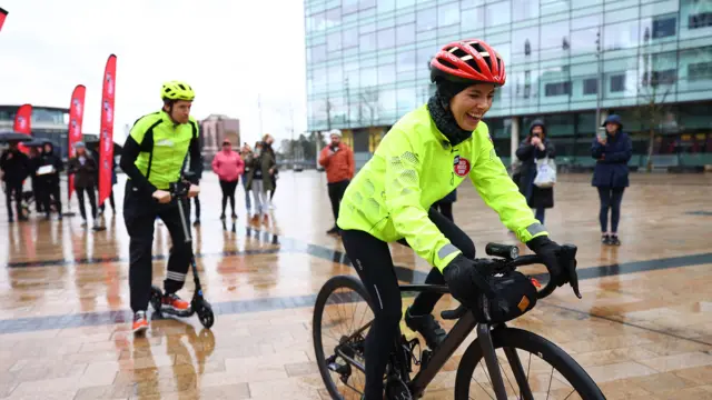 Greg James on Sccoter and Mollie King on bike