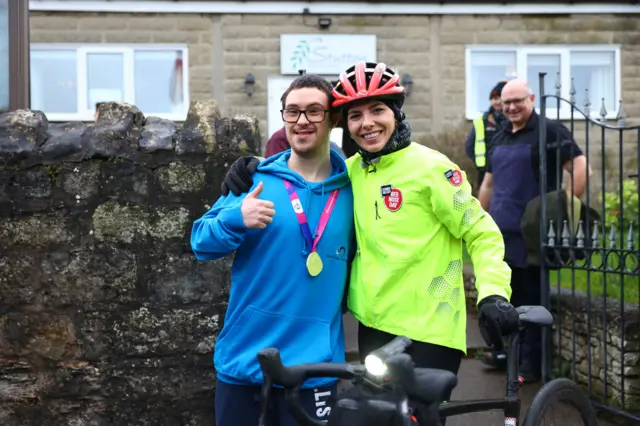 Mollie King stops for photos