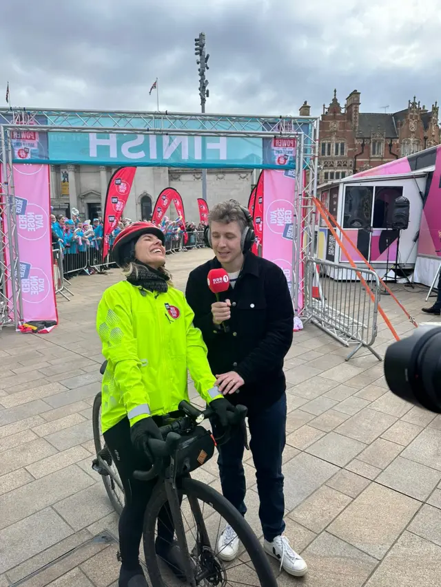 Mollie crosses the finish line and is joined by Matt Edmondson