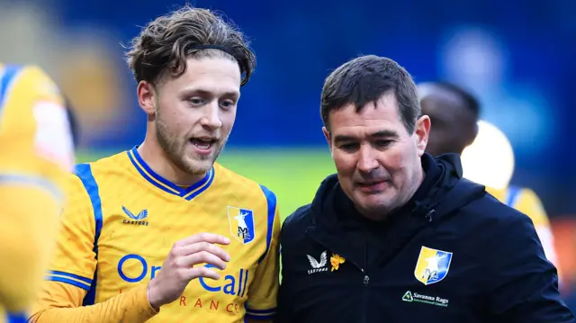 Mansfield Town Manager Nigel Clough talks with Will Swan of Mansfield Town