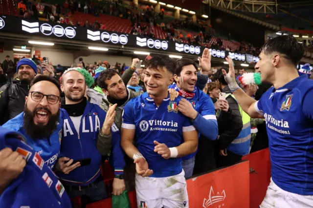 Italy players celebrate with fans