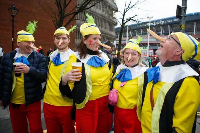 Fans dressed as Pinocchio