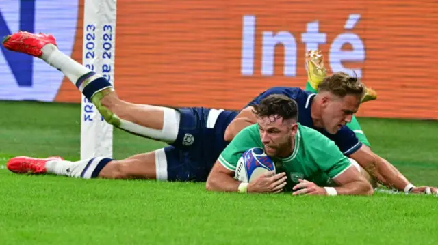 Hugo Keenan scores a try against Scotland