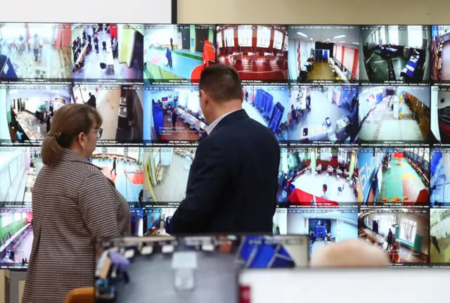 Observers watch a live broadcast from polling stations at the Public election monitoring centre during the Russia's presidential election in Volgograd, Russia March 16, 2024.