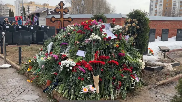 At Borisovsky Cemetery, Muscovites are placing flowers at the grave of the late opposition leader Alexei Navalny