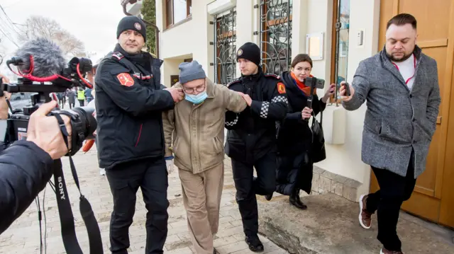 Officers detain a man who threw a handmade molotov cocktail towards the Russian Embassy in Chisinau, 17 March 2024