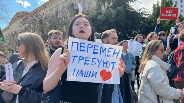 Protestors with placards in Tbilisi, Georgia