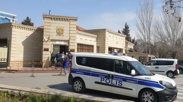 Police cars near a polling station in Baku, Azerbaijan