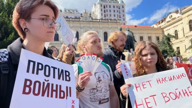 Protestors with placards in Tbilisi, Georgia