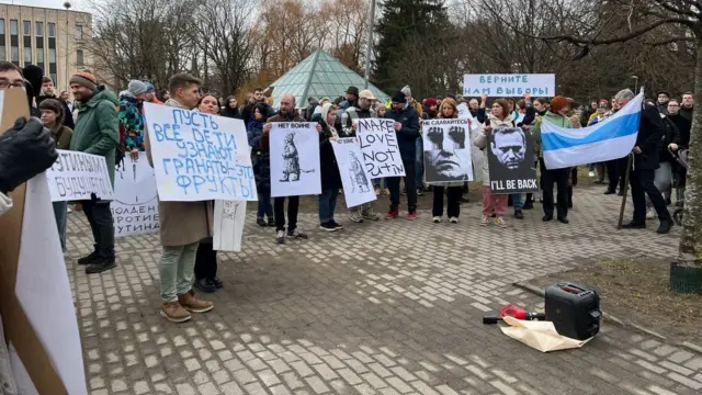 Protestors with placards gathered in Riga