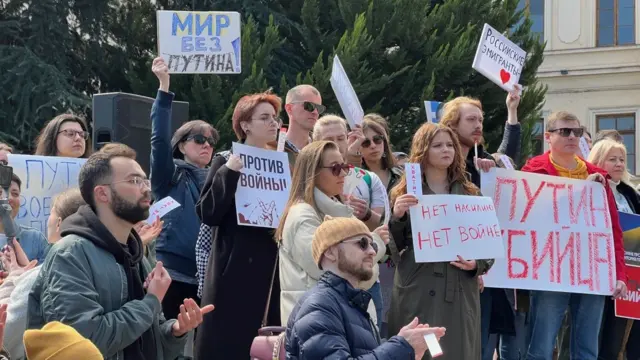 Protesters with placards in Tbilisi, Georgia