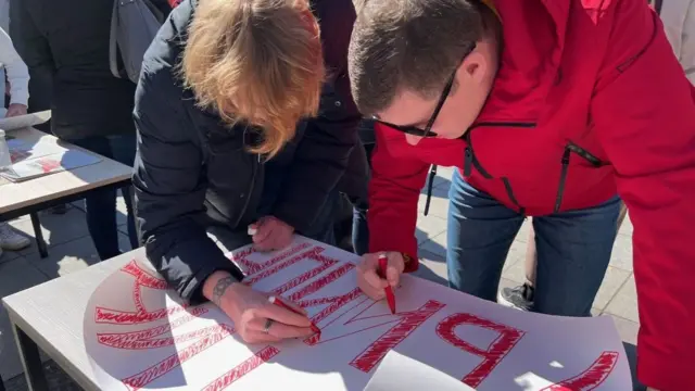 Protestors write placards in Tbilisi, Georgia