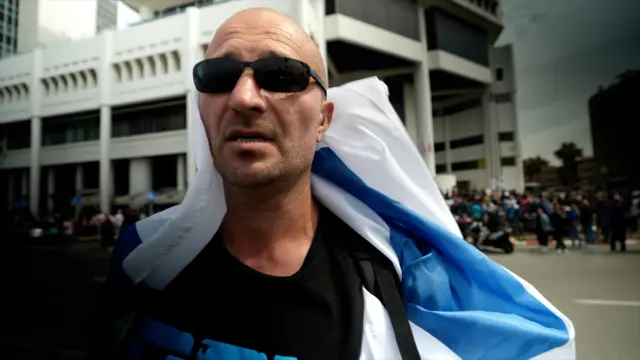 A man draped in a flag