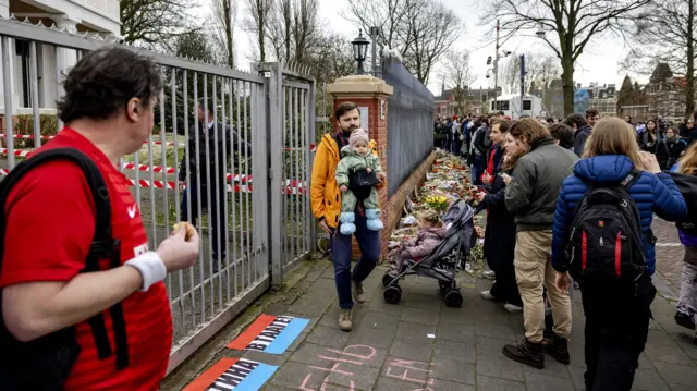 Russians wait in line to vote at the Russian embassy in The Hague, Netherlands as the team of Navalny had called Russians to show their opposition to the elections, by crowding voting centers at midday - 17 March 2024