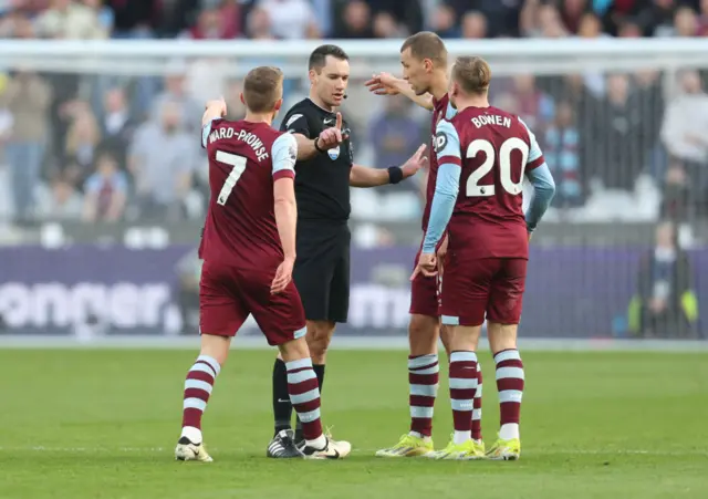 West Ham players and the referee