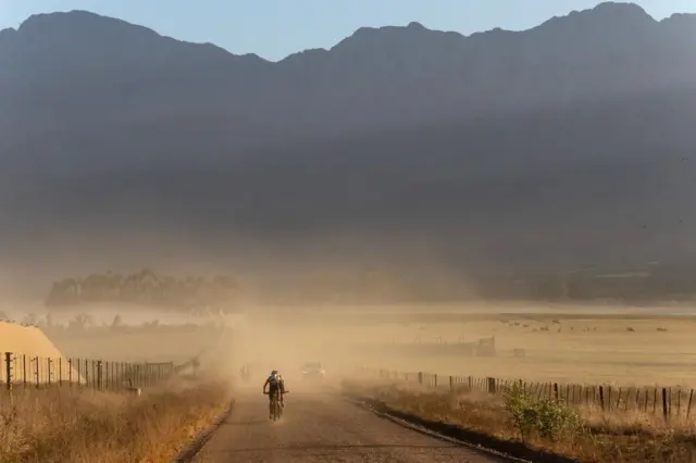 Riders race in the dust during stage 1 of the ABSA Cape Epic MTB race over 88 km with 2540m of climbing in Saronsberg, South Africa, 18 March 2024