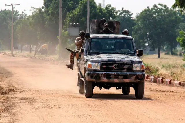 Nigerian Army soldiers are seen driving on a military vehicle in Ngamdu, Nigeria, on November 3, 2020