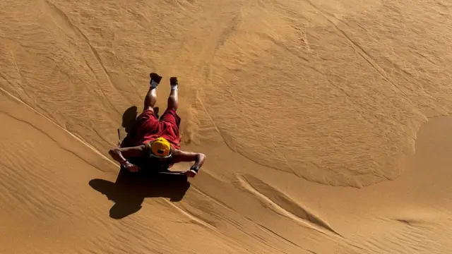 A person sandboarding