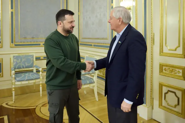 Zelensky shaking hands with Lindsay Graham