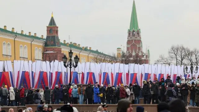 People arrive for a rally and a concert in Red Sqaure