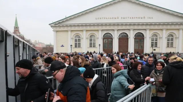 Crowds go through metal detectors near Red Square