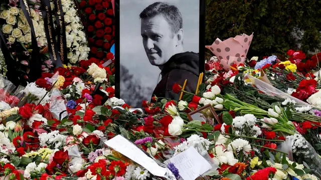 A portrait of Russian opposition politician Alexei Navalny is placed amid flowers at his grave the day after the funeral at the Borisovskoye cemetery in Moscow, Russia