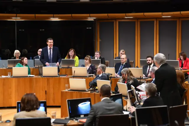 Plaid Cymru leader Rhun ap Iorwerth addresses Mark Drakeford during FMQs