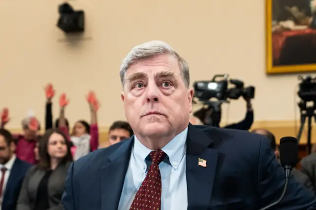 Former Chairman of the Joint Chiefs of Staff Gen. Mark Milley takes his seat before the start of the House Foreign Affairs Committee hearing