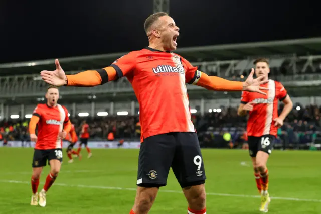 Carlton Morris screams in delight as he celebrates scoring the equaliser in front of the home end.