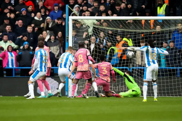 Michal Helik scores for Huddersfield against Leeds