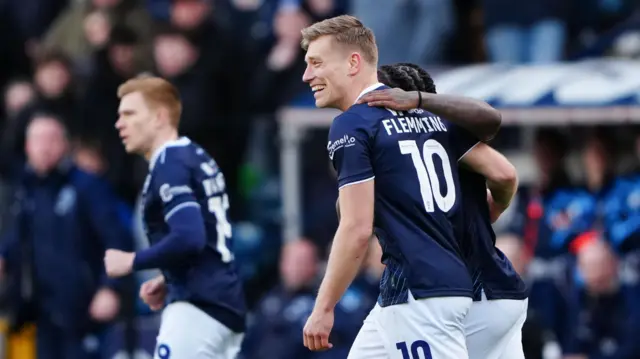 Zian Flemming celebrates scoring for Millwall against Watford