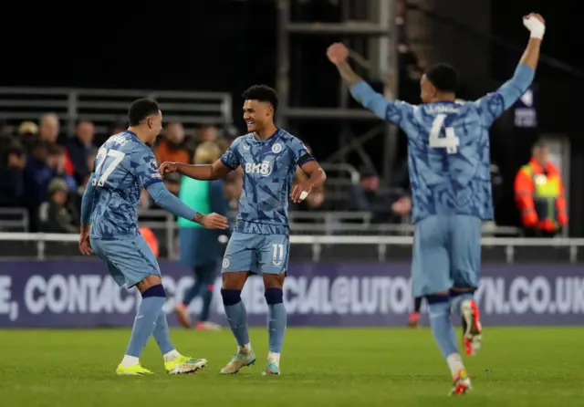 Watkins is congratulated by teammates after VAR award his second goal v Luton.