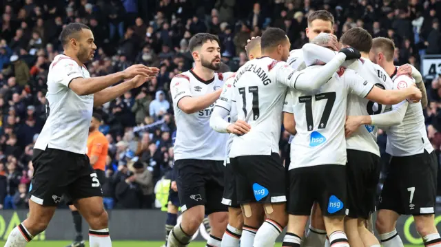 Derby players celebrating