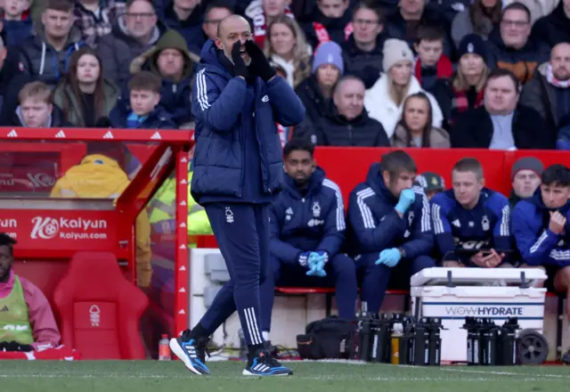 Nuno shouts instructions to his players from his technical area.