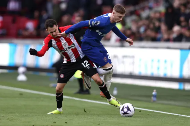 Reguilon battles Palmer on the wing.