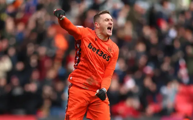 Stoke keeper Daniel Iversen celebrates Bae Junho's goal against Middlesbrough