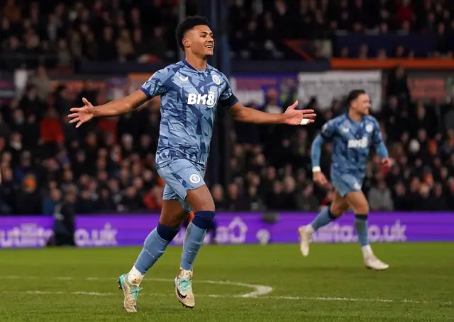 Ollie Watkins celebrates scoring the opening goal at Luton.