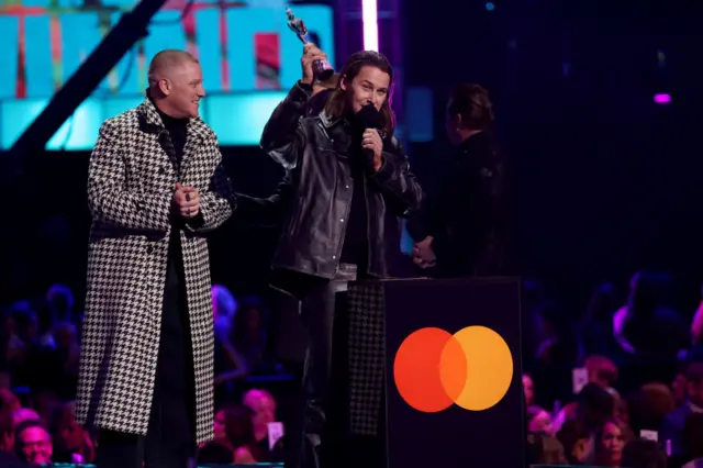 Jungle group on stage collecting Brit Award