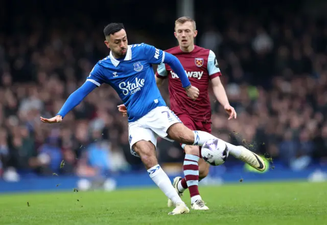 Dwight McNeil holds off a challenge in midfield.