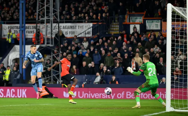 Digne heads past Kaminski for a likely late Villa winner.