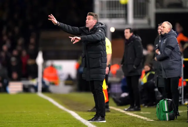 Rob Edwards gestures instructions from the touchline.