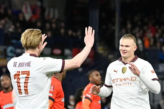 Erling Haaland celebrates with Manchester City's Belgian midfielder Kevin De Bruyne