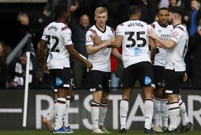 Derby players celebrate scoring against Port Vale