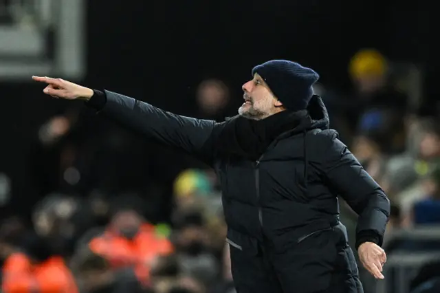 Pep Guardiola gives instructions on the touchline